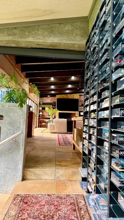 Modern loft interior hallway with media storage and ambient lighting