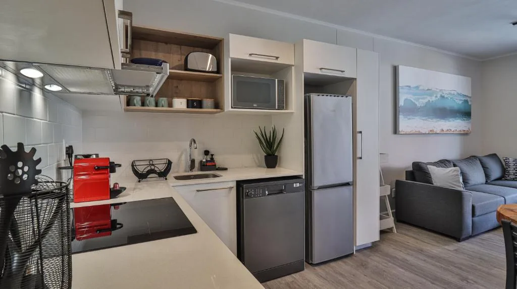 Modern kitchen with stainless steel appliances and open shelving