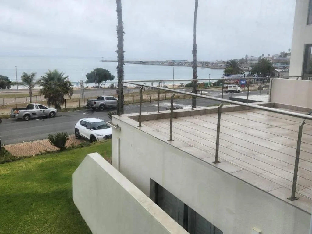 Lagoon and coastal town views from elevated deck with modern railings