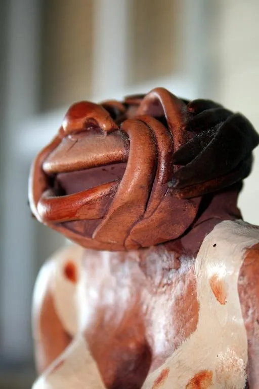 Close-up of carved wooden hippo sculpture, decorative property accent