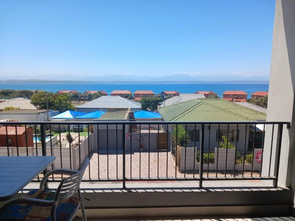 Expansive ocean and lagoon views from balcony with mountains beyond