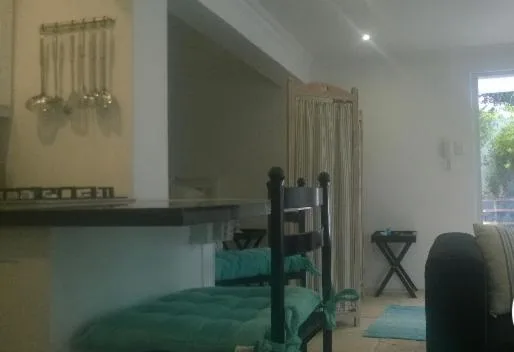 Bedroom with teal bunk bed and natural light from window