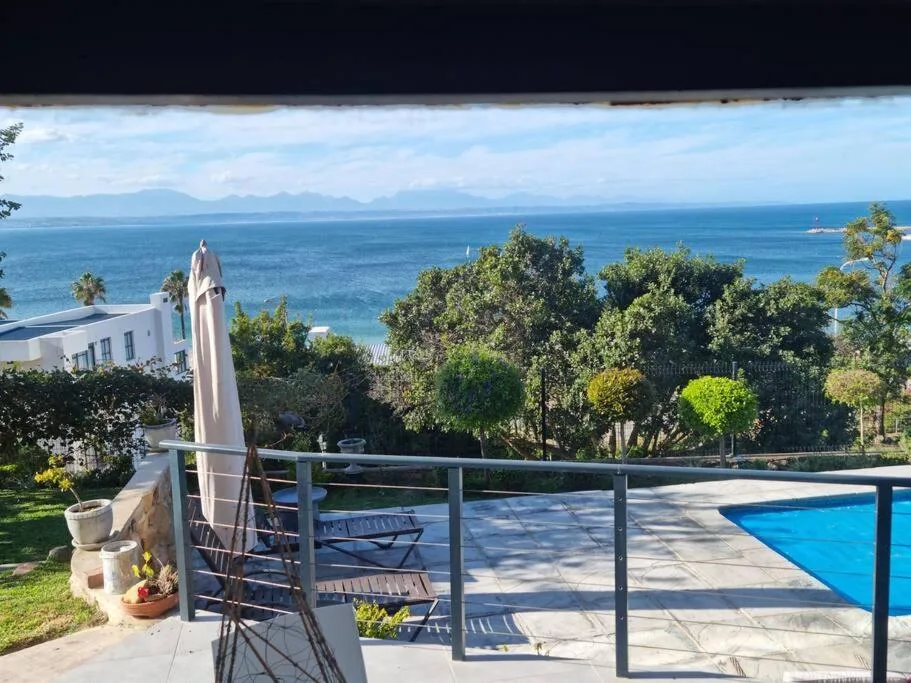 Panoramic coastal ocean view with mountains visible from property deck