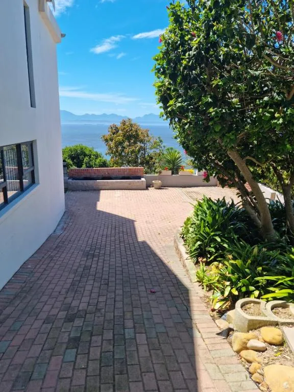 Ocean and mountain vista visible from property's outdoor patio area