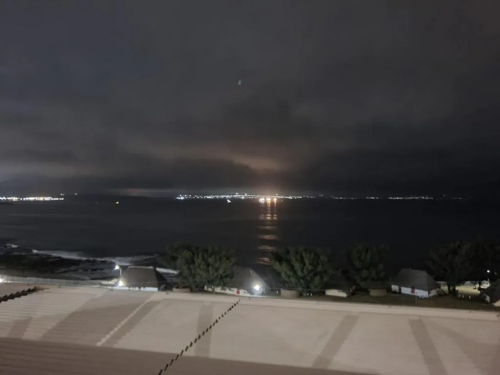 Night view of Mossel Bay harbor and coastal lights from property deck