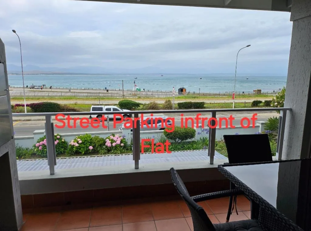 Oceanfront view of Mossel Bay beach and coastline from apartment balcony