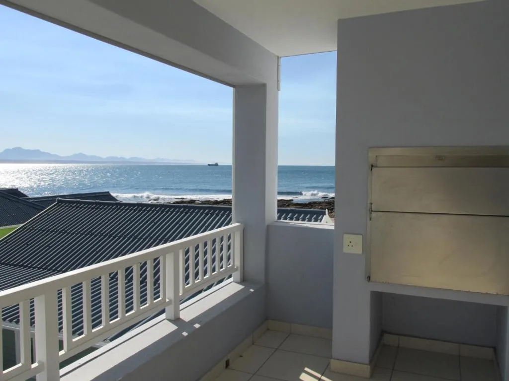 Ocean view from balcony with mountains visible on horizon