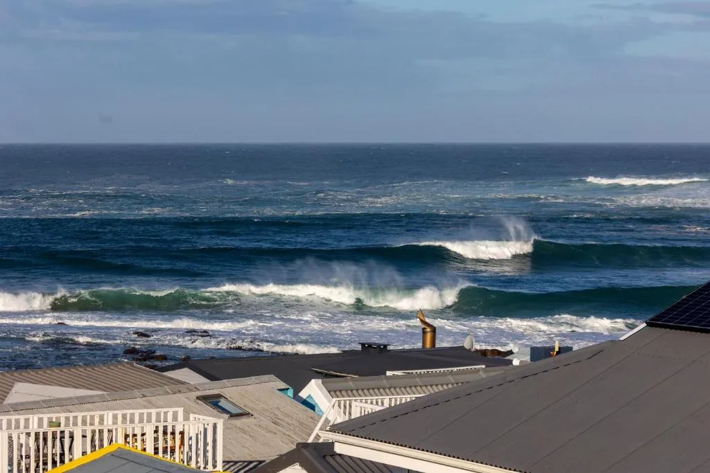 Spectacular ocean waves and coastal landscape from property vantage point