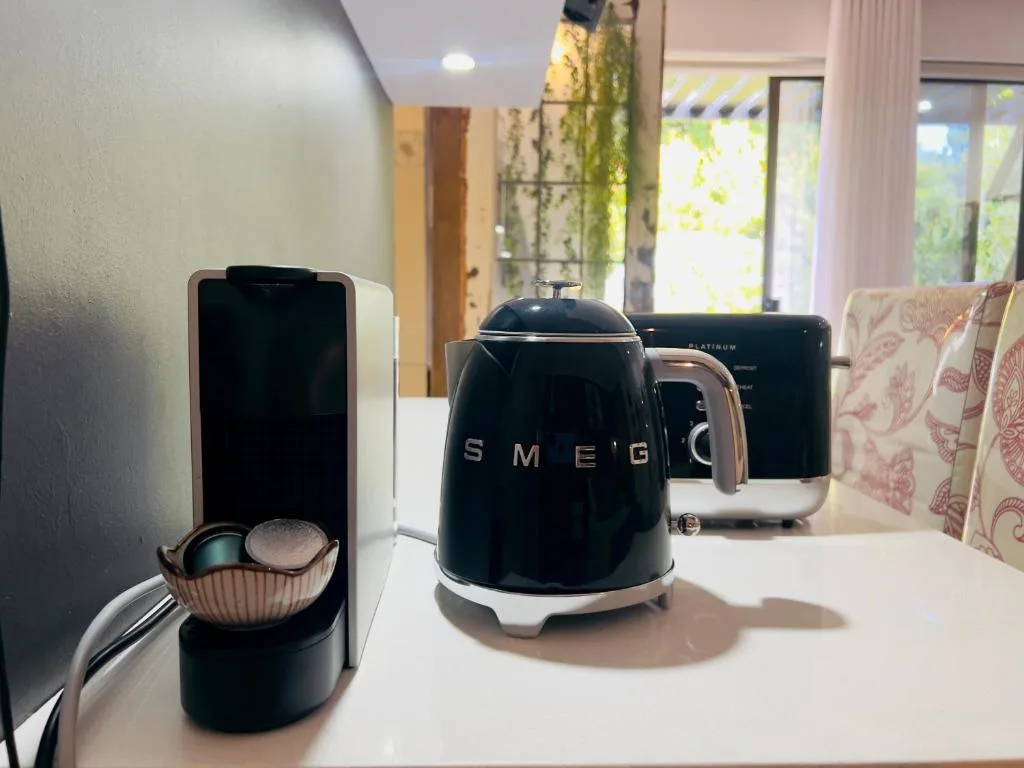 Modern kitchen counter with stylish Smeg appliances and coffee maker