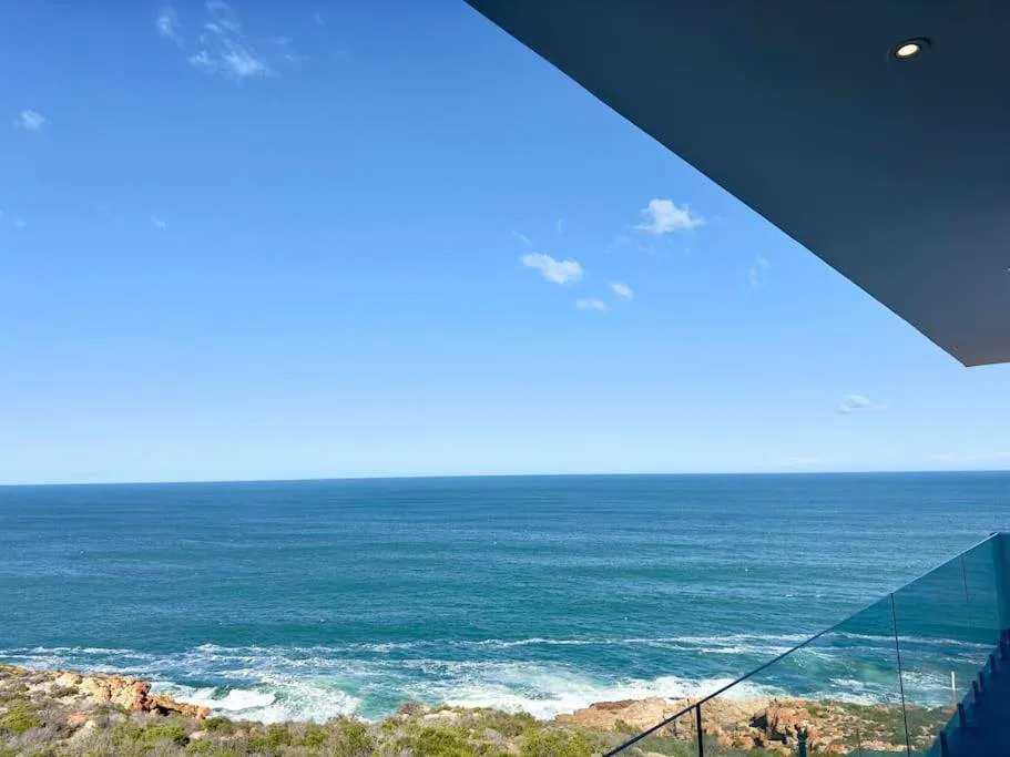 Panoramic ocean view with waves and coastline from property deck