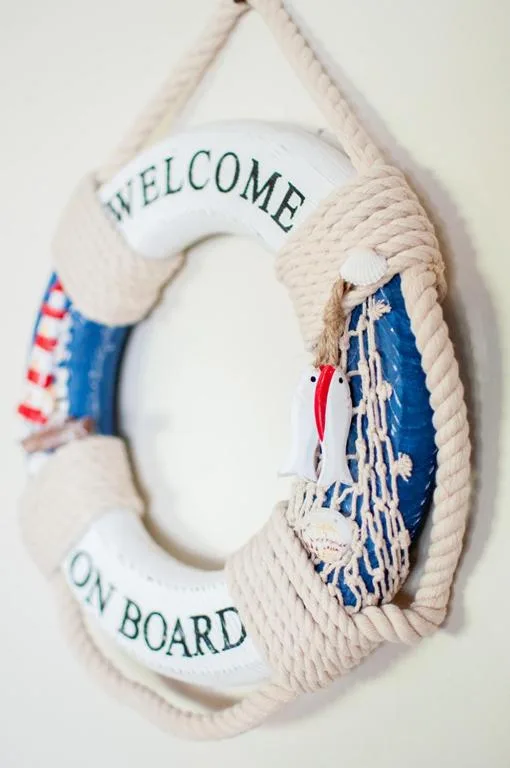 Nautical welcome sign with rope and decorative maritime elements