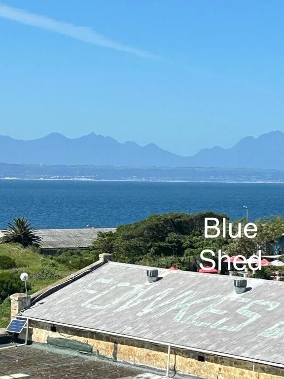 Scenic view of mountains and ocean from property rooftop area