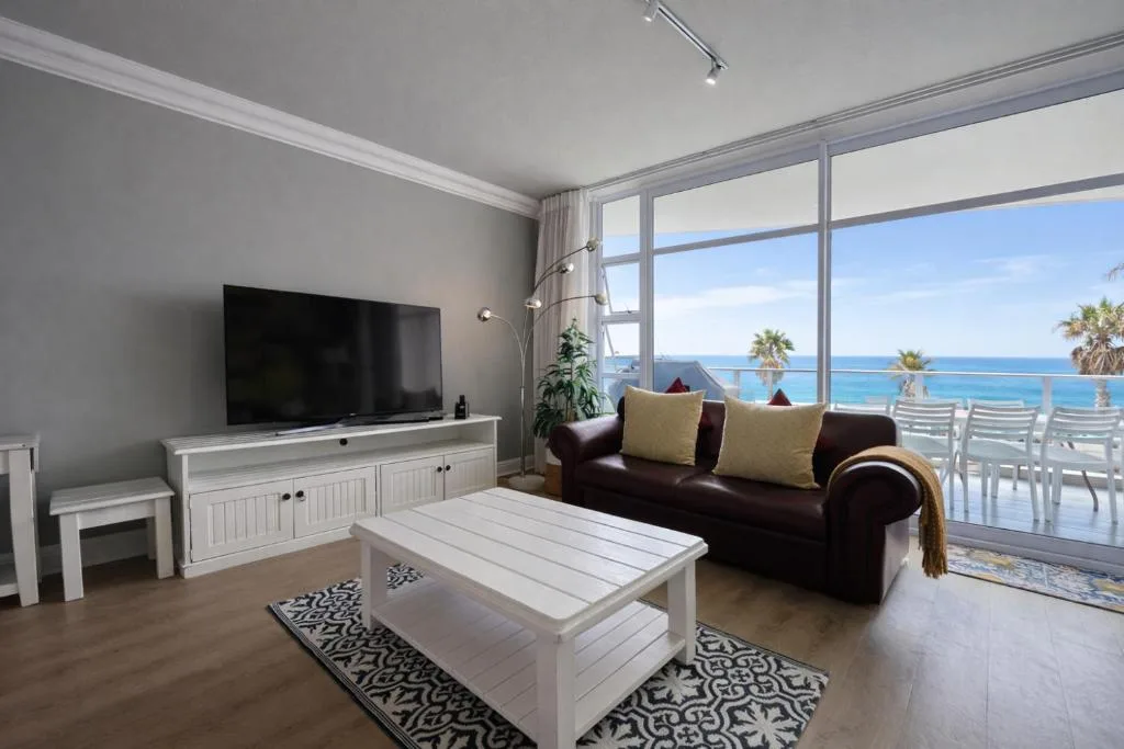 Modern lounge with ocean view through large sliding glass doors