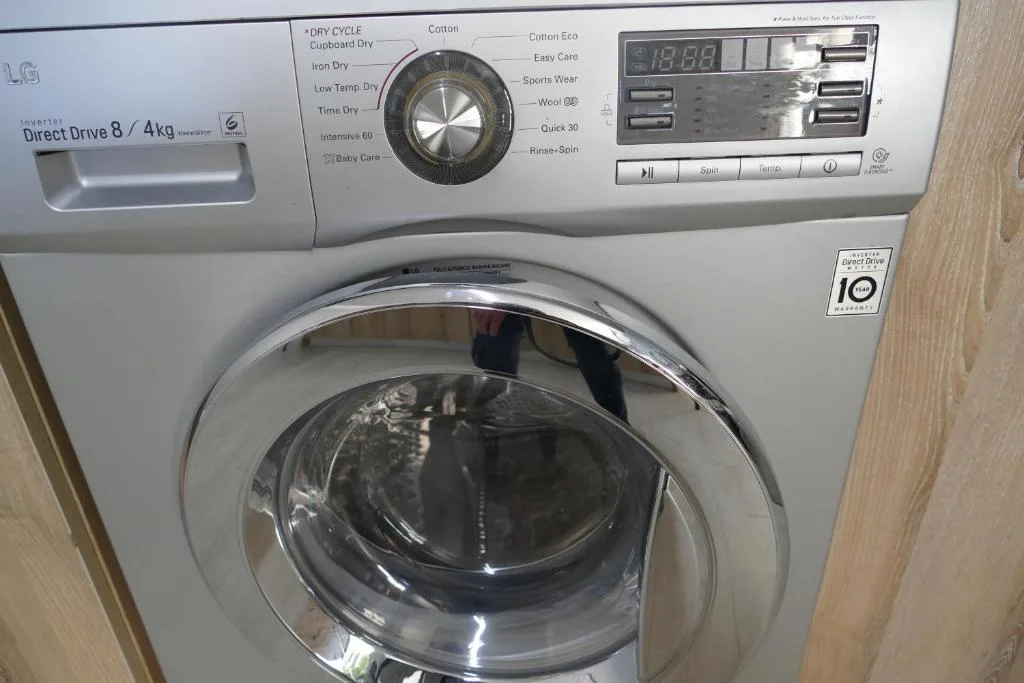 Modern LG washing machine with direct drive technology and digital controls