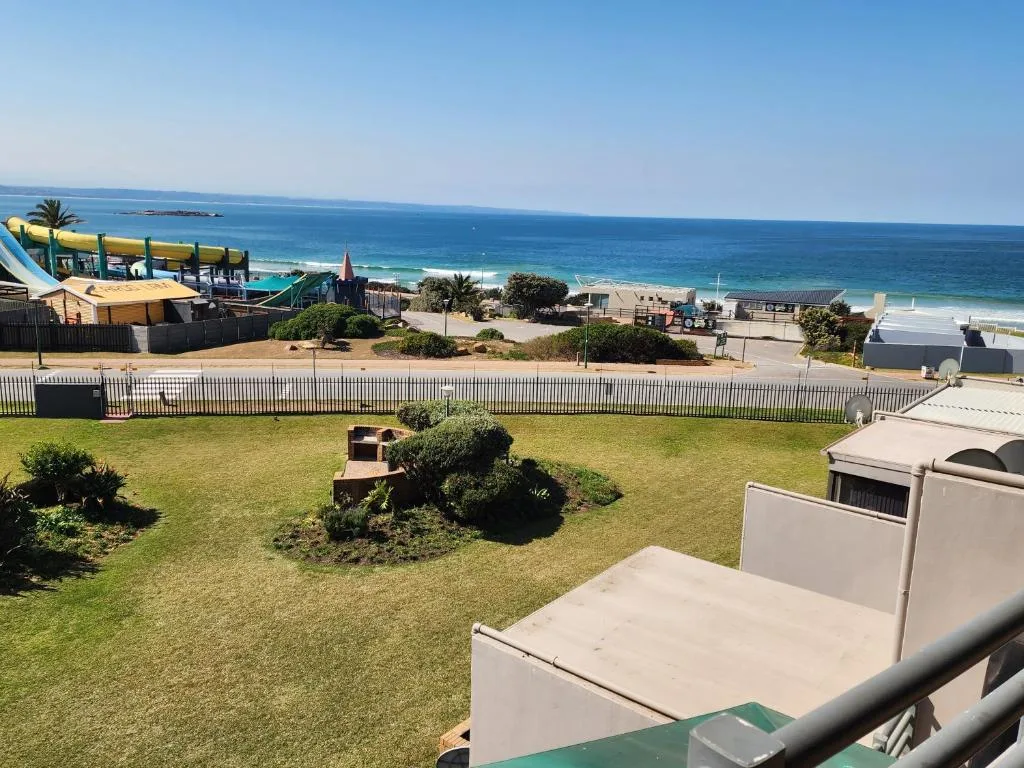 Expansive ocean and beach vista from elevated property viewpoint