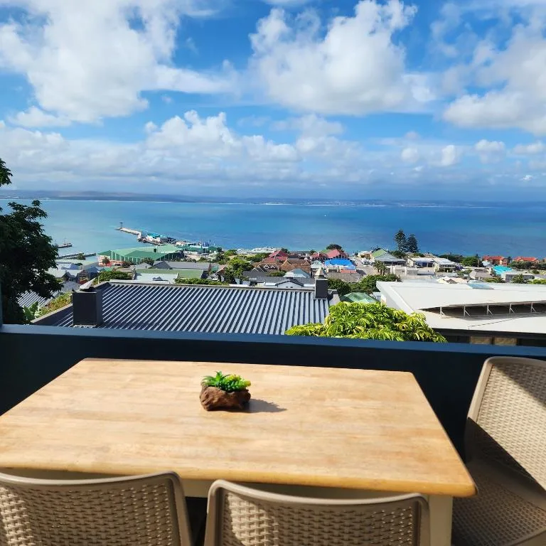 Expansive coastal view of Mossel Bay harbour and turquoise ocean waters