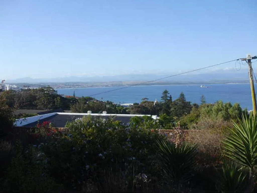 Expansive sea and mountain vista overlooking Mossel Bay's blue waters