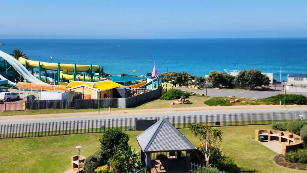 Oceanfront property view with pristine blue sea and coastal landscape
