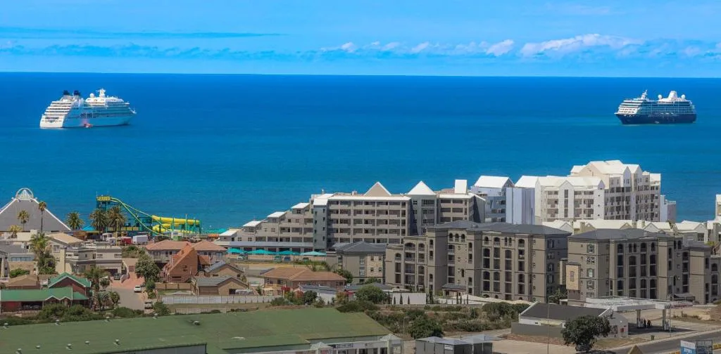 Ocean view with cruise ships and beachfront development