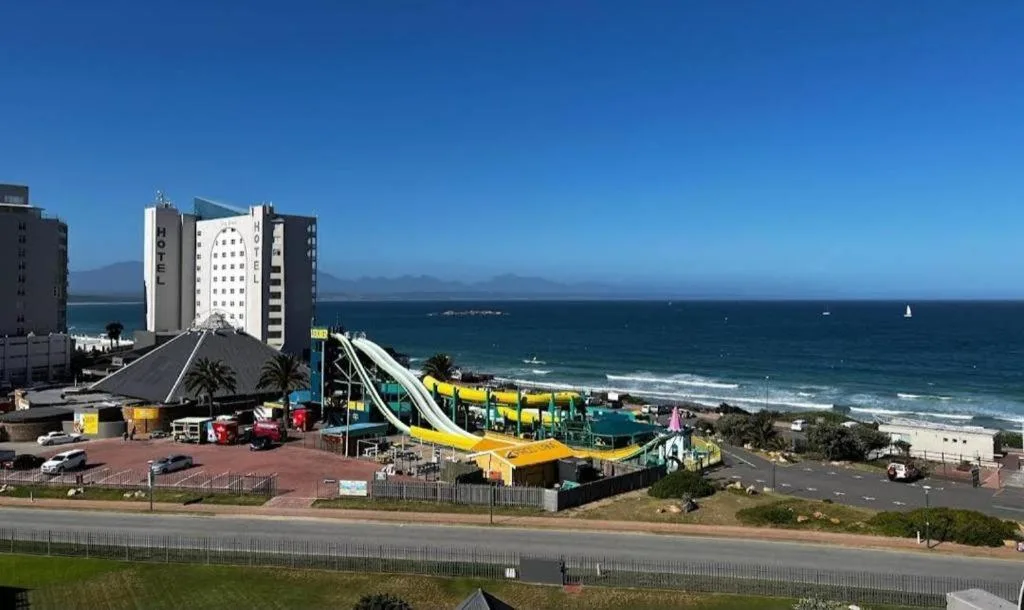 Scenic coastal view of ocean, beach, and seaside town development