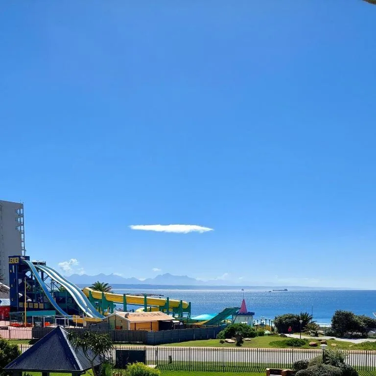 Clear blue ocean and mountain vista seen from property grounds