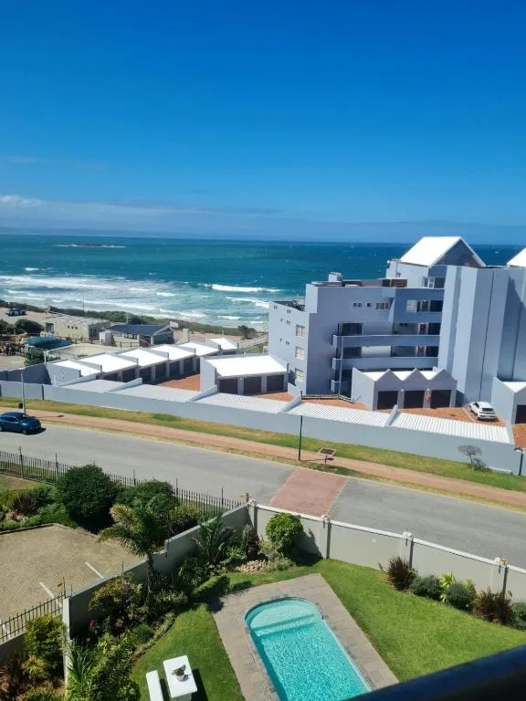 Ocean view with waves and coastal landscape from property overlooking beach
