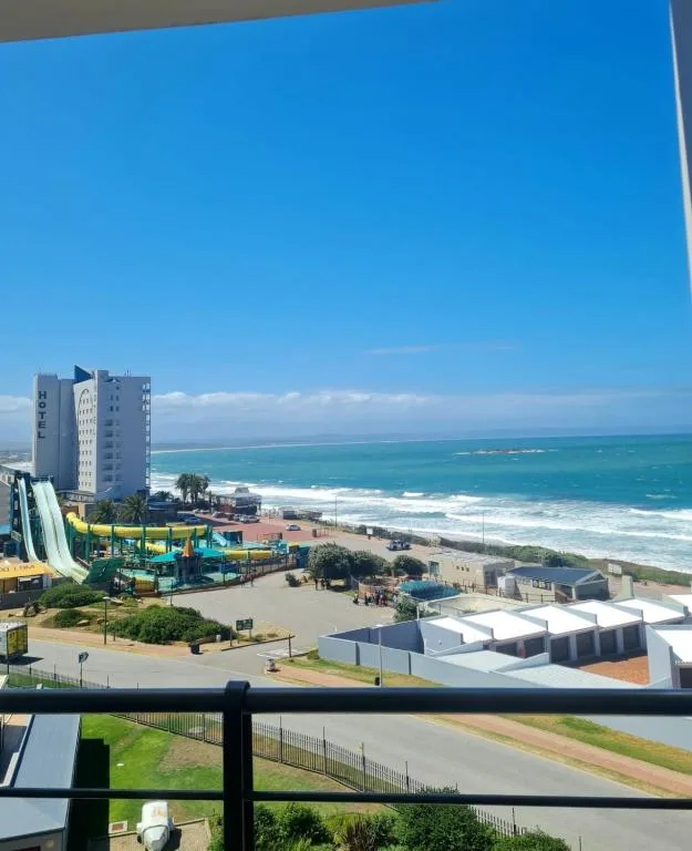Expansive ocean and beach view from elevated apartment balcony, Mossel Bay