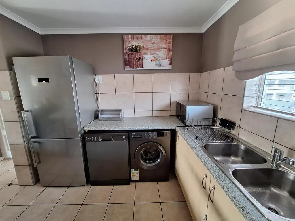 Modern kitchen with stainless steel appliances and double sink