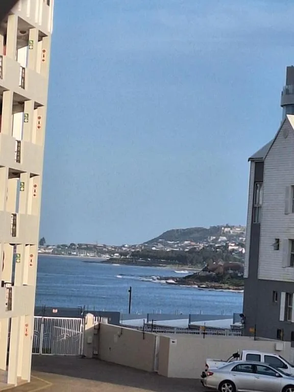 Scenic coastal view of blue ocean and hillside town from property