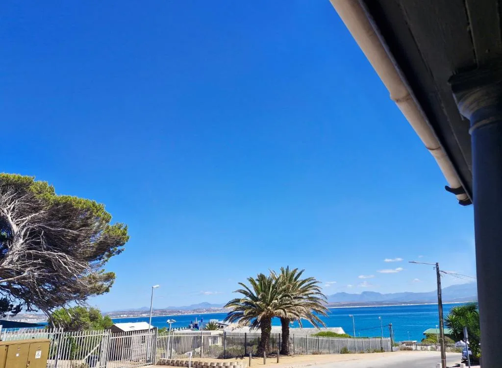 Scenic coastal view of blue ocean and mountains from property vantage point
