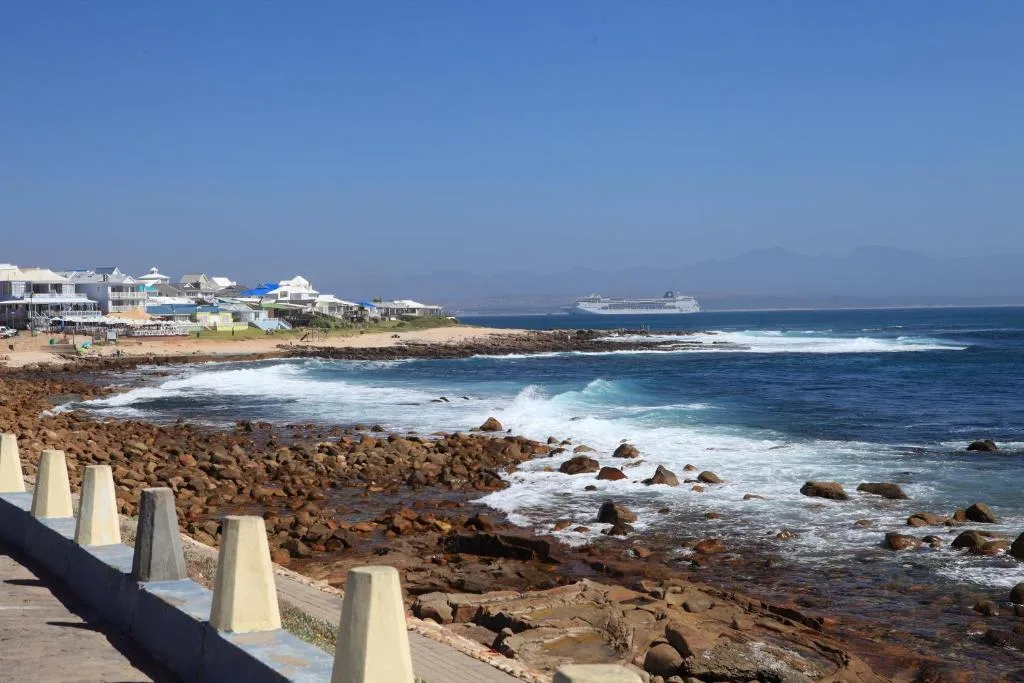 Coastal ocean view with rocky shoreline and properties along the Garden Route