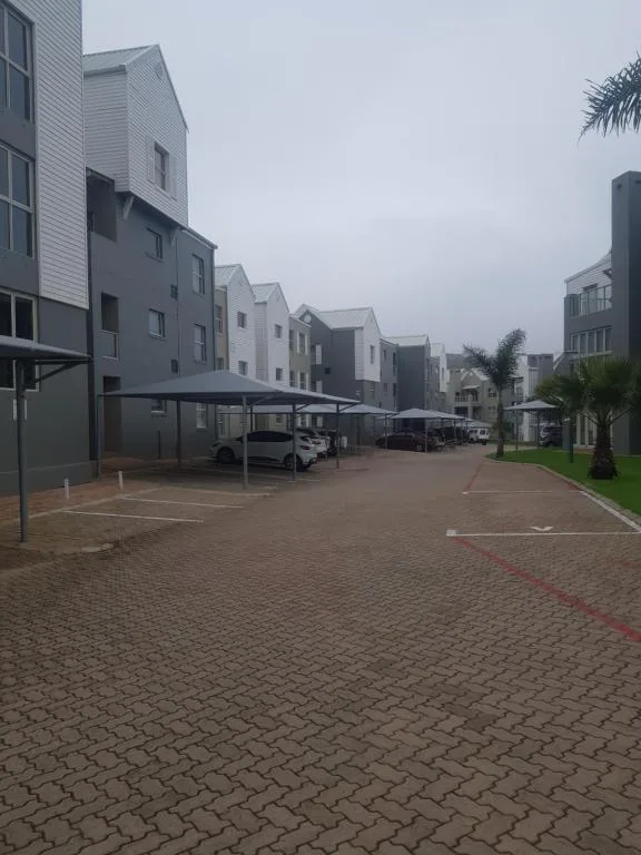 Contemporary apartment complex with multiple units and secure parking area