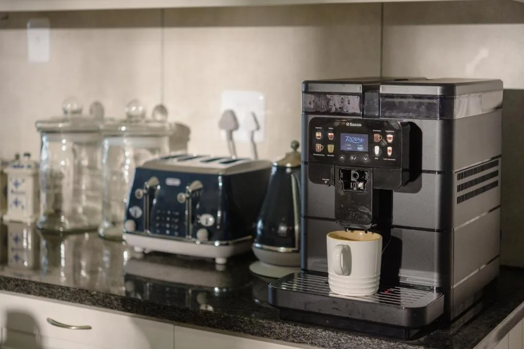 Modern kitchen counter with espresso machine and stylish appliances