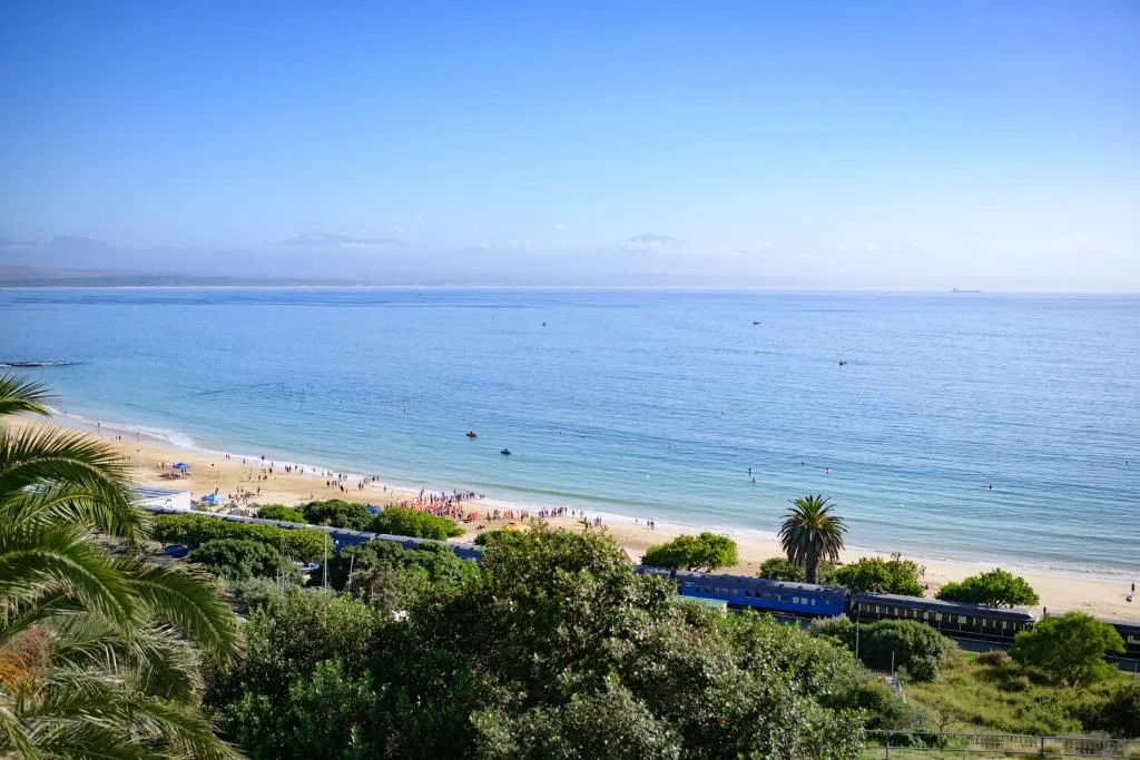 Expansive ocean and beach view with calm blue waters and sandy shore