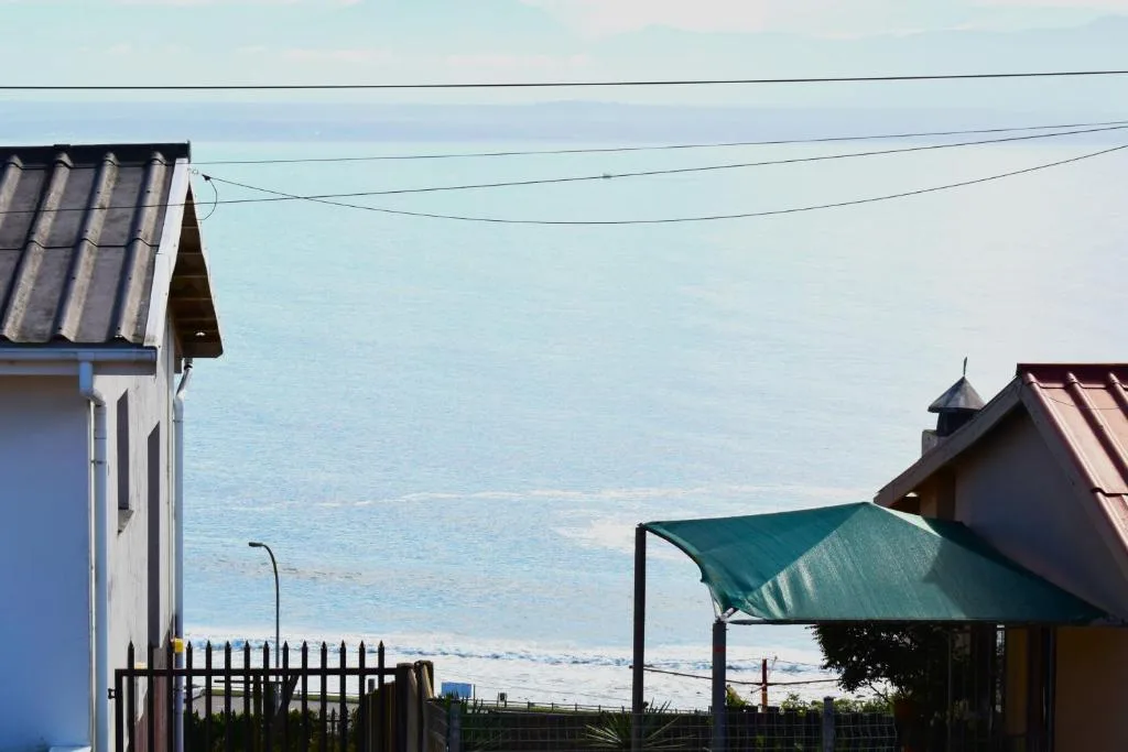 Expansive ocean view across Mossel Bay with coastal properties in foreground