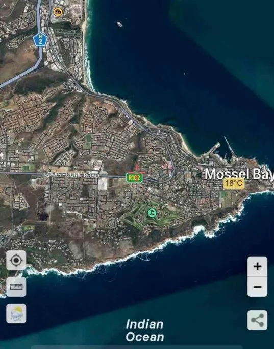 Aerial map view of Mossel Bay coastal town and Indian Ocean shoreline