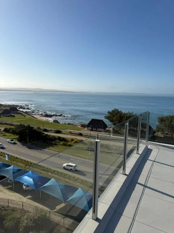 Panoramic ocean and coastal landscape vista from elevated seaside property