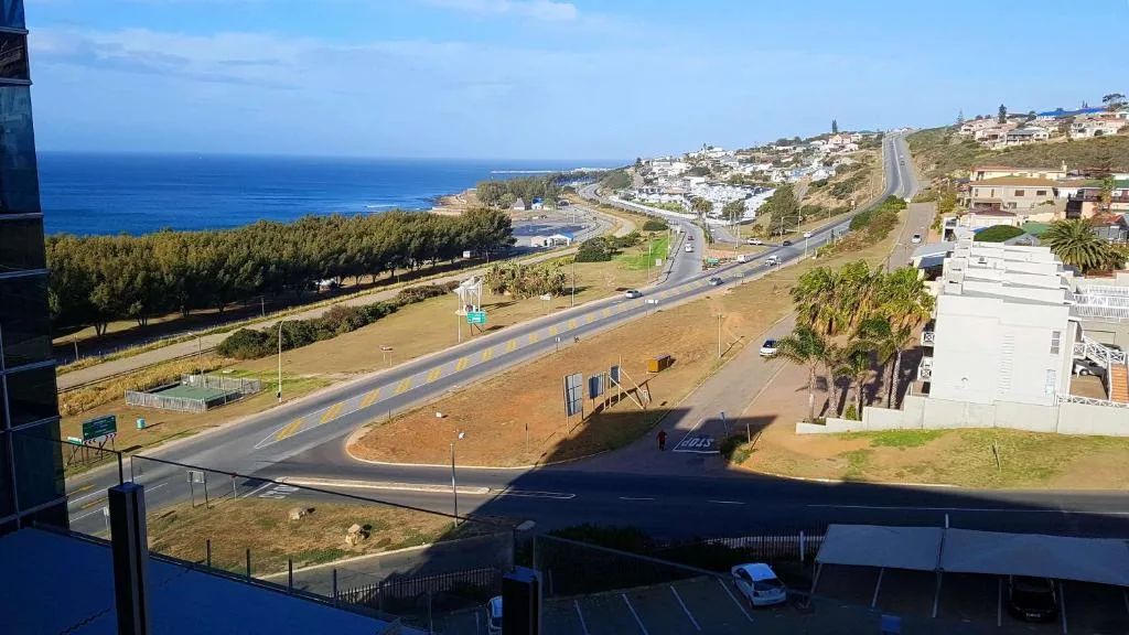 Scenic coastal view of Mossel Bay with ocean, beach, and town landscape