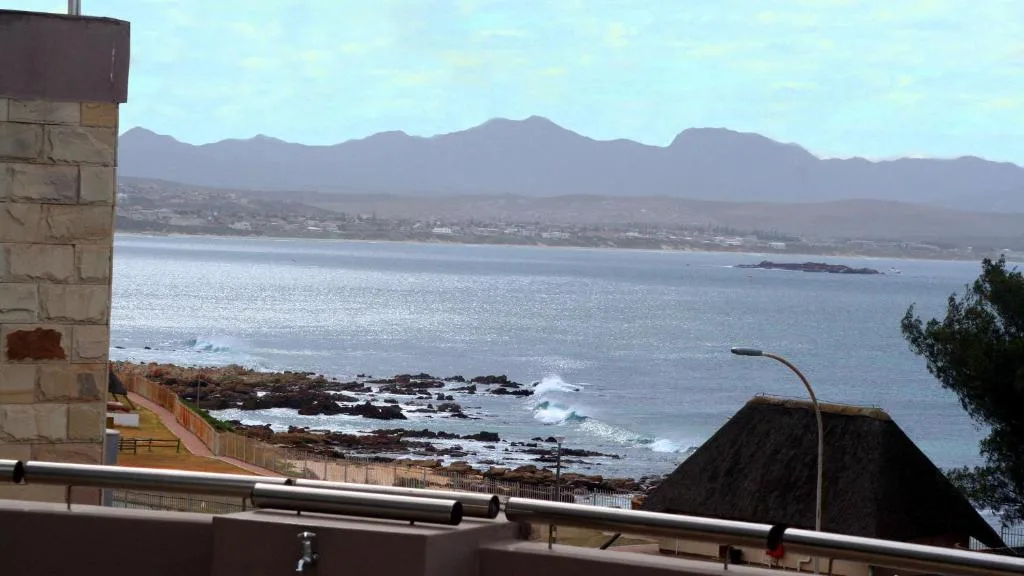 Panoramic ocean and mountain vista from seaside property overlooking bay