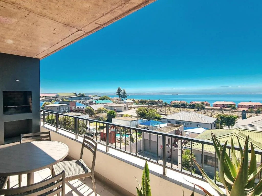 Panoramic ocean and coastal town views from elevated deck area