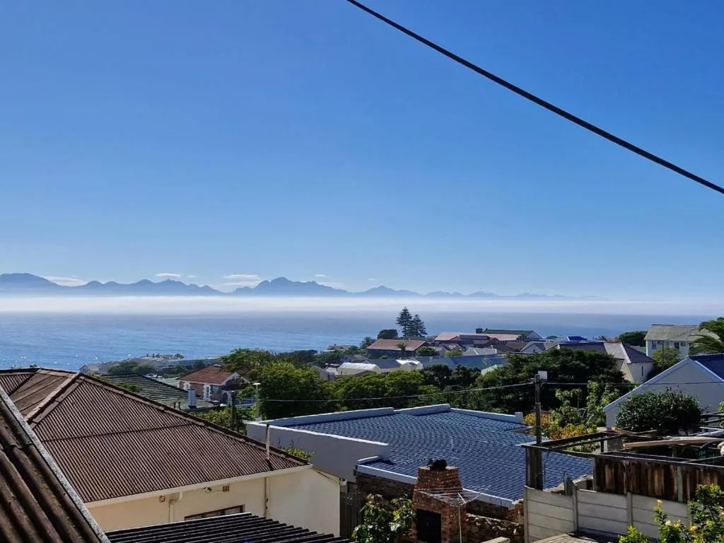 Scenic ocean and mountain vista with coastal town below