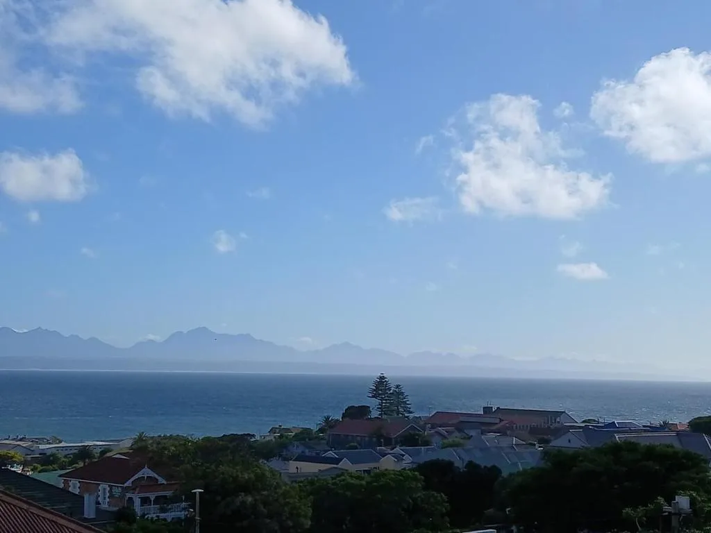 Scenic coastal view with mountains and ocean from property vantage point
