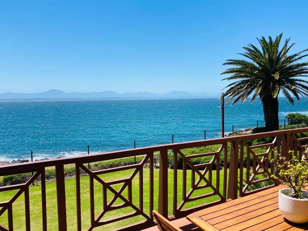 Panoramic ocean and mountain vista from beachfront property deck