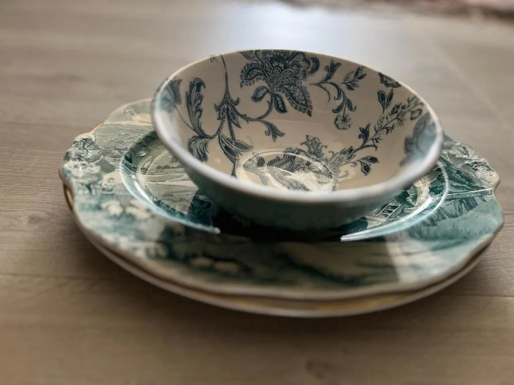 Elegant porcelain teacup and saucer with delicate botanical pattern