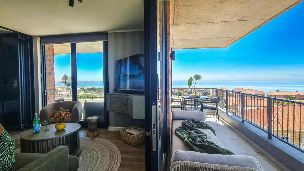 Expansive ocean-view deck with seating and panoramic coastal horizons