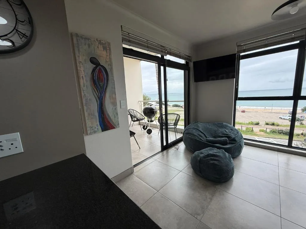 Modern lounge with bean bags and ocean views through large windows