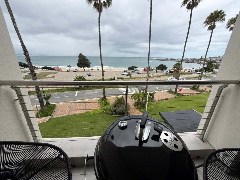 Panoramic ocean and beach view from beachfront apartment balcony