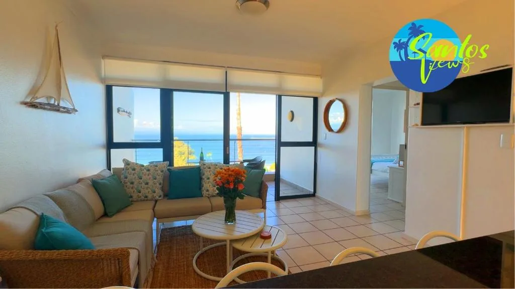 Coastal lounge with ocean views, sofa, and contemporary furnishings