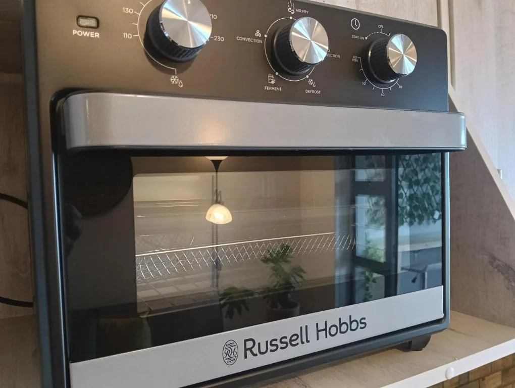 Russell Hobbs convection oven with multiple temperature controls and settings