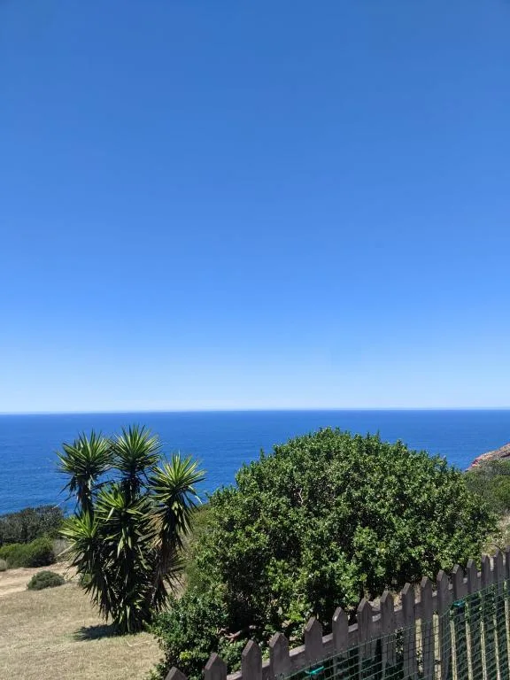Ocean view from property with clear blue sky and coastal landscape